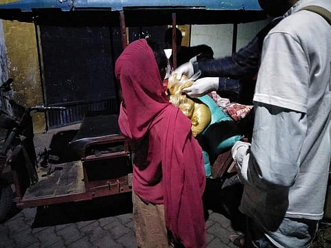 Students of AMU distributing materials