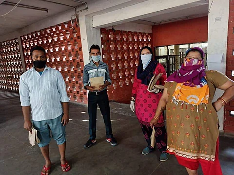 Sanitary workers after they received their kits. Credit: BASO team