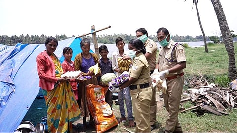 Gills and the other police officers with Darshan's family