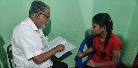 Suresh Kumar interacting with a students prior to the lockdown (Pic: Facebook)