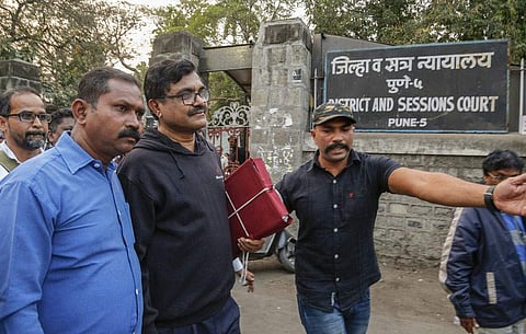 Activist Anand Teltumbde (black pullover) leaves after Pune District and Sessions Court released him in Bhima Koregaon case, in Pune on February 2, 2019 (Pic: PTI)