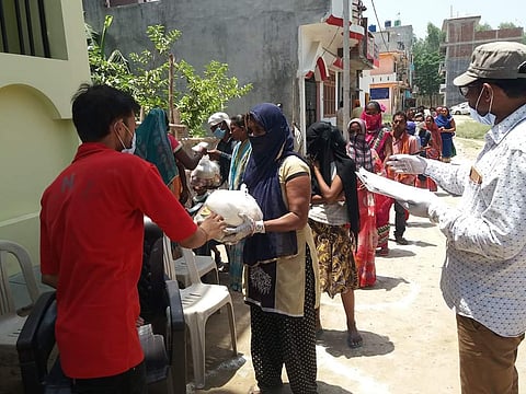 Researchers distributing aid (Pic: RSI)