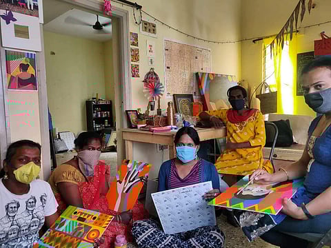 The members painting on canvas (Pic: Aravani Art Project)