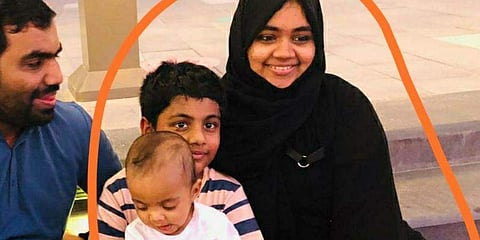 One year old Azam with his parents and sibling