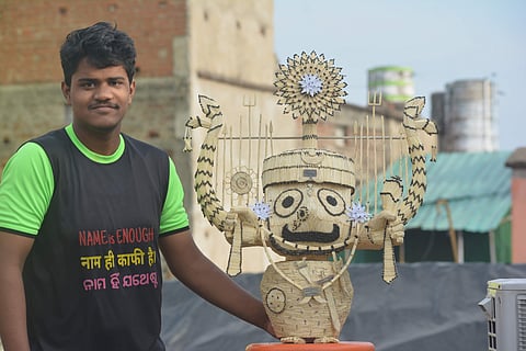 Saswat Ranjan Sahoo with the matchstick statue of Lord Jagannath | Pic: Saswat Ranjan Sahoo