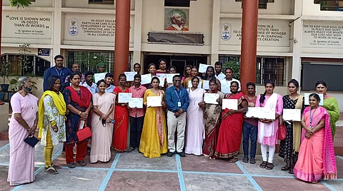 The students with their certificates with Rev Fr Joe Arun (Pic: LIBA)
