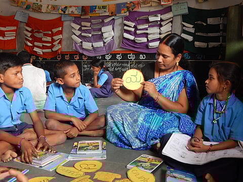 A teacher teaching kids to read and write Kannada comprehensively (Pictures: Kalike)