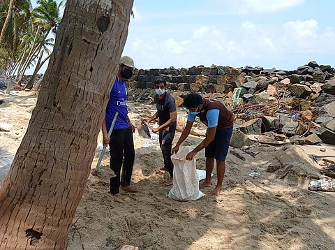The students first came together to help rebuild the sea wall temporarily