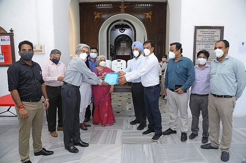 Bhaskar Ramamurthi, Director, IIT Madras, hands over oxygen concentrators to Gagandeep Singh Bedi, Commissioner, Chennai Corporation | Pic: IIT Madras