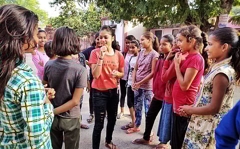 Empowerette team communicating with young girls (Pictures: Aditi Gera)
