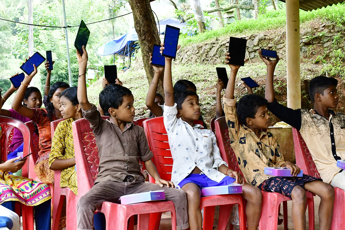 The tribal kids with their tablets | Pic courtesy: V Ummer Koya