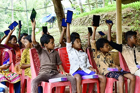 The tribal kids with their tablets | Pic courtesy: V Ummer Koya