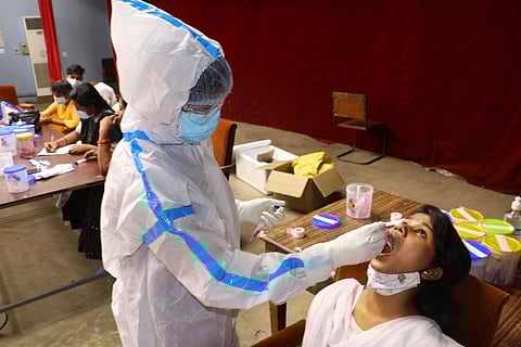 A girl being tested for CIVID-19 image for representational purpose only | (Pic: Express)