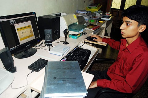 Student filling application form image for representative purpose only | (Pic: Express)