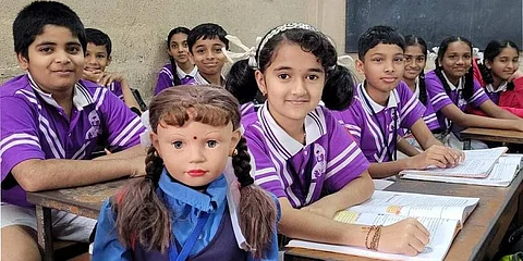 Shiksha, the robotic teacher dressed like a student, who is getting an overwhelming response from students in Karnataka | Pic: Express