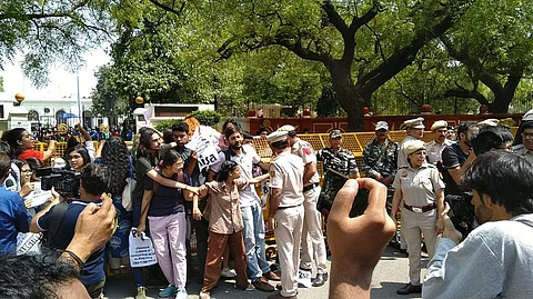 Police detaining students | (Pic: AISA)